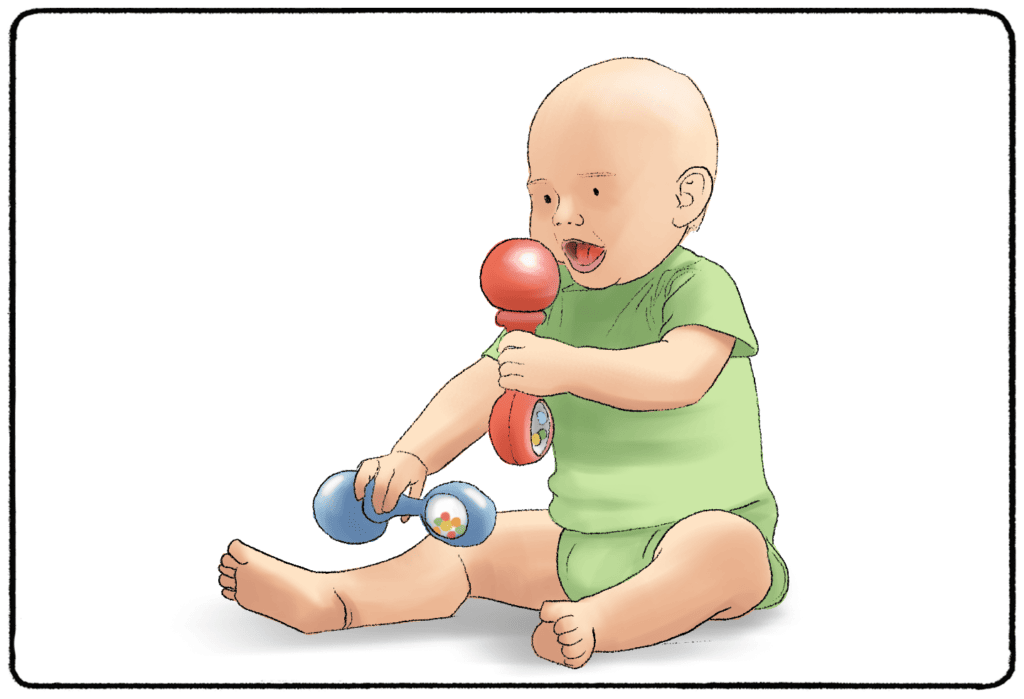 baby shaking a rattle